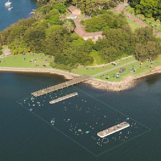 Ariel view of sea pool next to green landscape